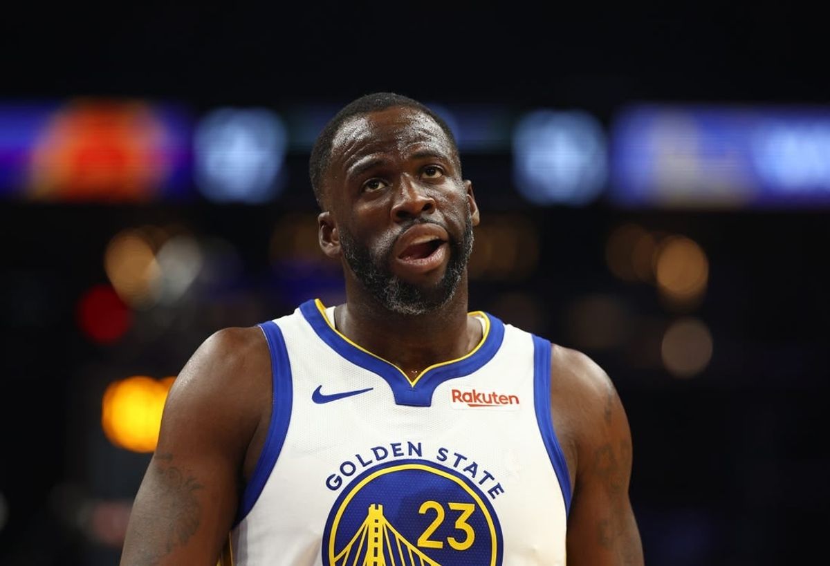 Dec 12, 2023; Phoenix, Arizona, USA; Golden State Warriors forward Draymond Green (23) reacts against the Phoenix Suns at Footprint Center.