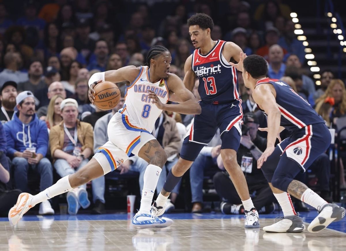 Feb 23, 2024; Oklahoma City, Oklahoma, USA; Oklahoma City Thunder forward Jalen Williams (8) drives to the basket against Washington Wizards guard Jordan Poole (13) during the second quarter at Paycom Center.