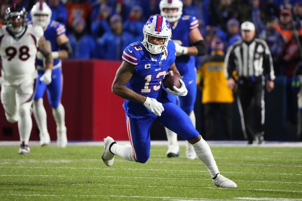 Nov 13, 2023; Orchard Park, New York, USA; Buffalo Bills wide receiver Gabe Davis (13) runs with the ball after making a catch against the Denver Broncos during the second half at Highmark Stadium.