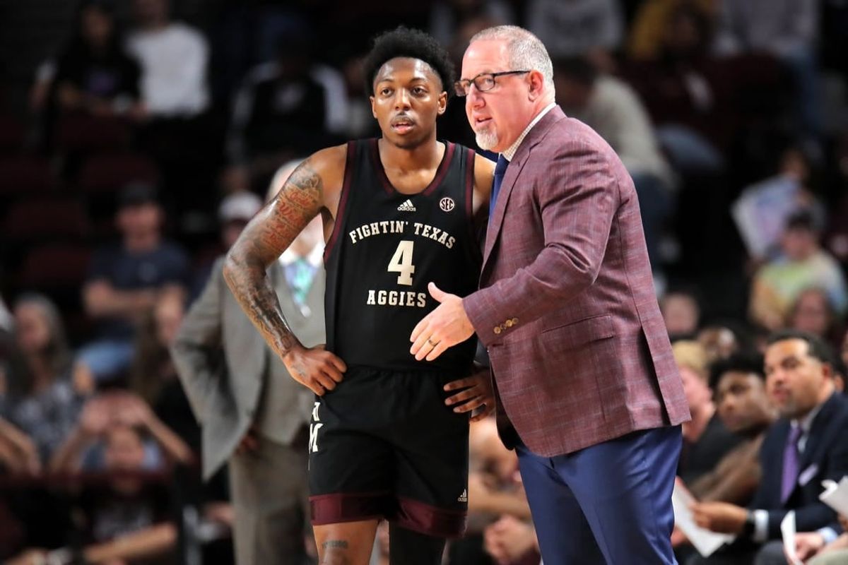 Dec 22, 2023; College Station, Texas, USA; Texas A&M Aggies head coach Buzz Williams (right) talks with Texas A&M Aggies guard Wade Taylor IV (4) against the Houston Christian Huskies during the first half at Reed Arena.