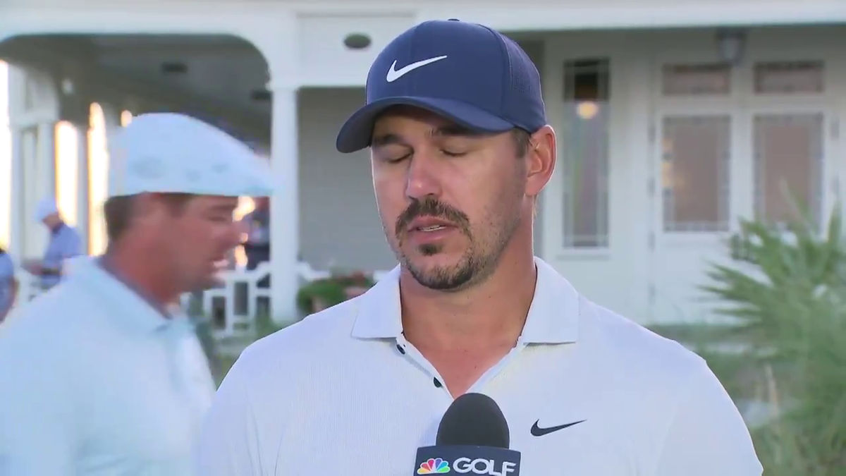 Brooks Koepka rolls his eyes SUPER HARD as Bryson DeChambeau walks behind him mid-interview.