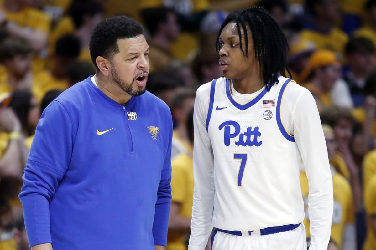 Jan 9, 2024; Pittsburgh, Pennsylvania, USA;  Pittsburgh Panthers head coach Jeff Capel (left) talks with guard Carlton Carrington (7) against the Duke Blue Devils during the first half at the Petersen Events Center.