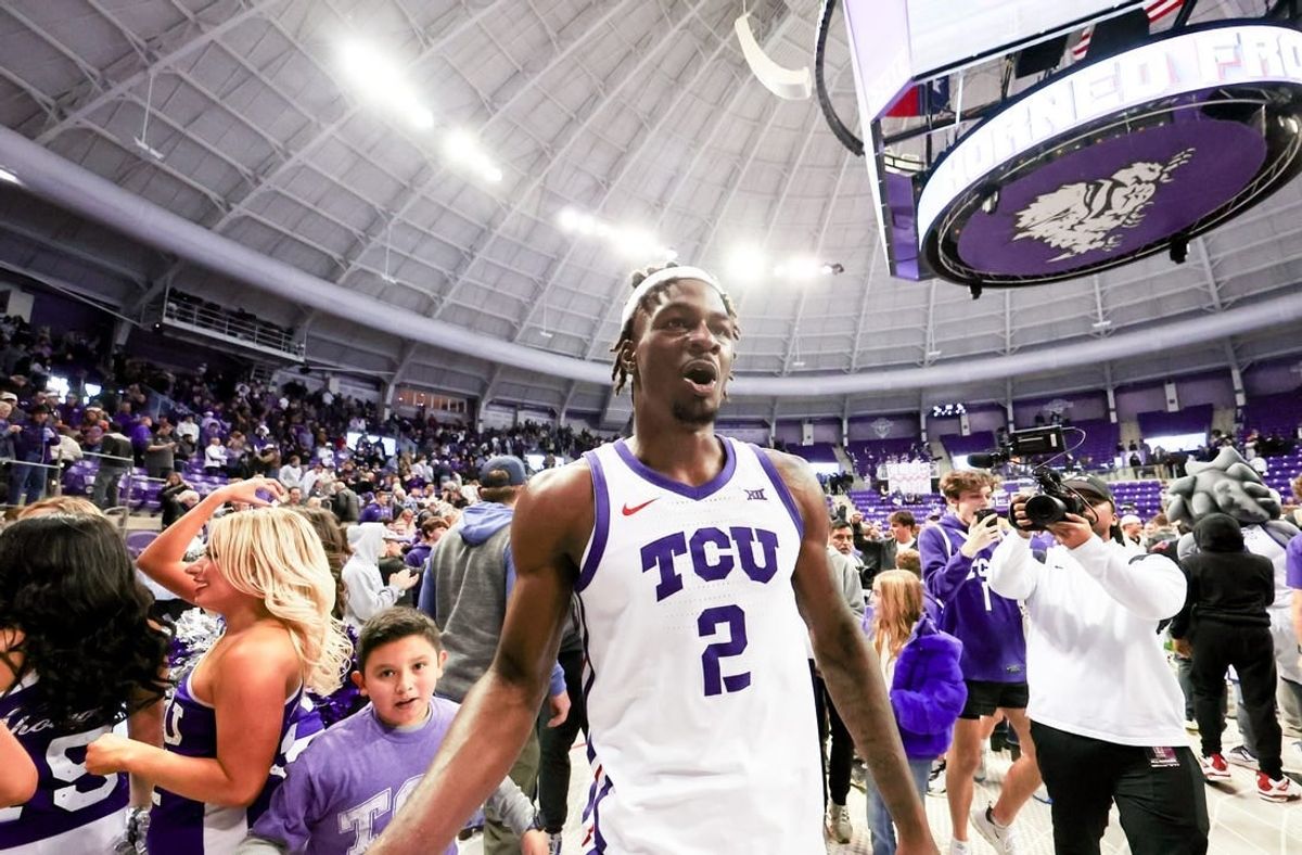 Jan 13, 2024; Fort Worth, Texas, USA; TCU Horned Frogs forward Emanuel Miller (2) celebrates with fans after the game against the Houston Cougars at Ed and Rae Schollmaier Arena.