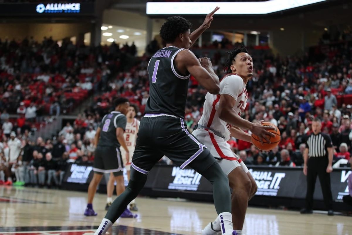 Jan 13, 2024; Lubbock, Texas, USA;  Texas Tech Red Raiders guard D Maurian Williams (5) looks to the basket against Kansas State Wildcats wing David N Guessan (1) in the first half at United Supermarkets Arena.