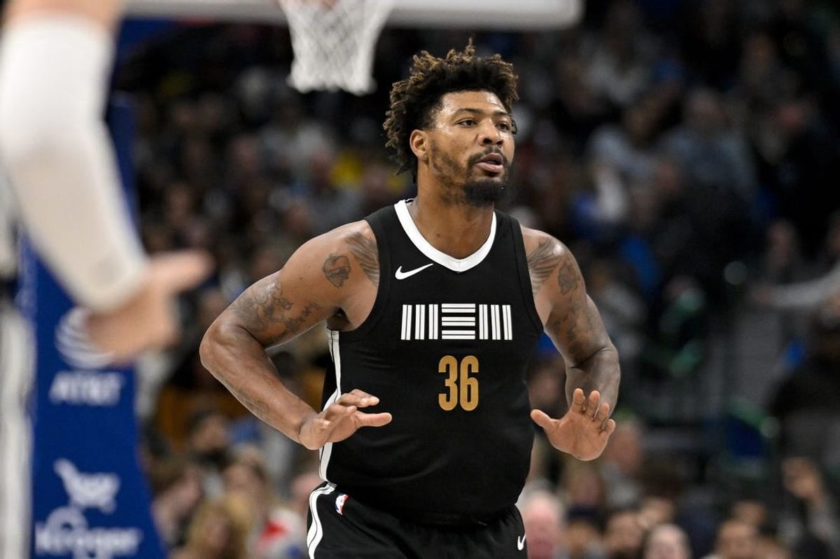 Jan 9, 2024; Dallas, Texas, USA; Memphis Grizzlies guard Marcus Smart (36) celebrates after he makes a three point shot against the Dallas Mavericks during the second half at the American Airlines Center.