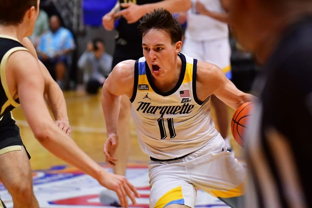 Nov 22, 2023; Honolulu, HI, USA; Marquette Golden Eagles guard Tyler Kolek (11) drives the ball down court defended by Purdue Boilermakers forward Camden Heide (23) during the second period at SimpliFi Arena at Stan Sheriff Center.