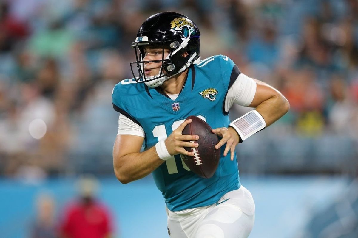 Aug 26, 2023; Jacksonville, Florida, USA;  Jacksonville Jaguars quarterback Nathan Rourke (18) drops back to pass against the Miami Dolphins in the third quarter at EverBank Stadium.