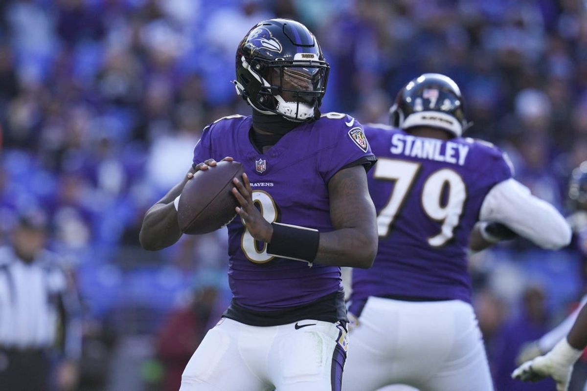 Nov 12, 2023; Baltimore, Maryland, USA;  Baltimore Ravens quarterback Lamar Jackson (8) passes the ball against the Cleveland Browns during the second half at M&T Bank Stadium.