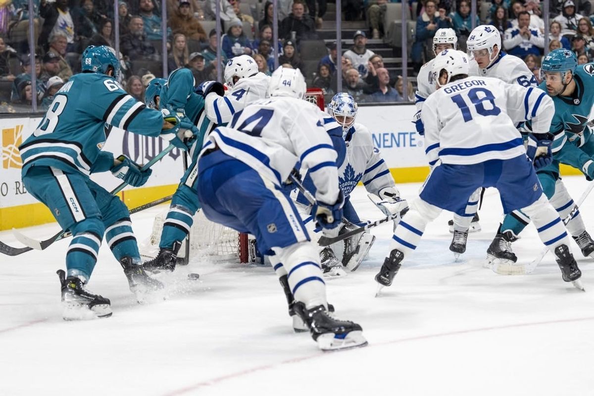 Jan 6, 2024; San Jose, California, USA; Toronto Maple Leafs goaltender Martin Jones (31) makes a save against San Jose Sharks center Mike Hoffman (68) during the second period at SAP Center at San Jose.