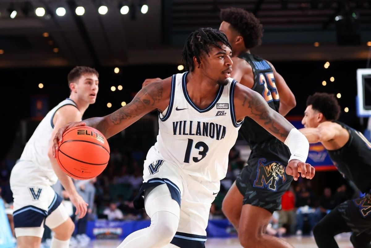Nov 24, 2023; Paradise Island, BAHAMAS;  Villanova Wildcats guard Hakim Hart (13) drives to the basket past Memphis Tigers guard Jayden Hardaway (25) during the first half at Imperial Arena.