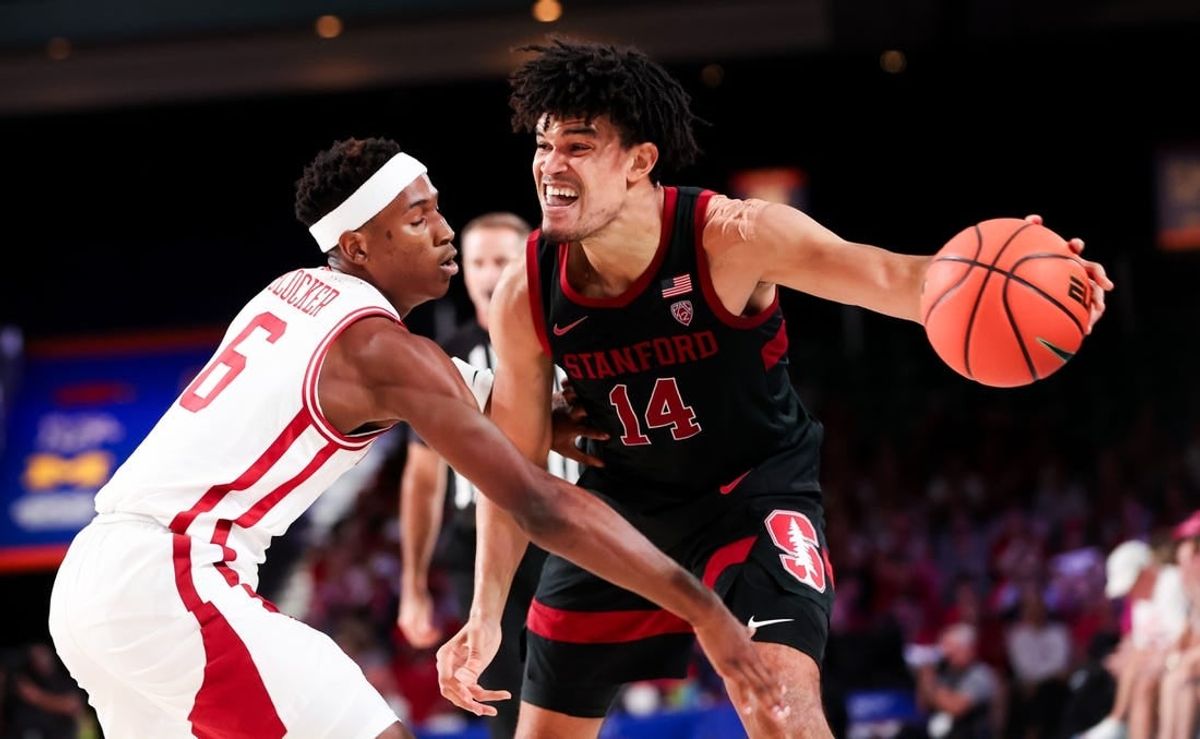 Nov 22, 2023; Paradise Island, BAHAMAS;  Stanford Cardinal forward Spencer Jones (14) controls the ball as Arkansas Razorbacks guard Layden Blocker (6) defends during the second half at Imperial Arena.