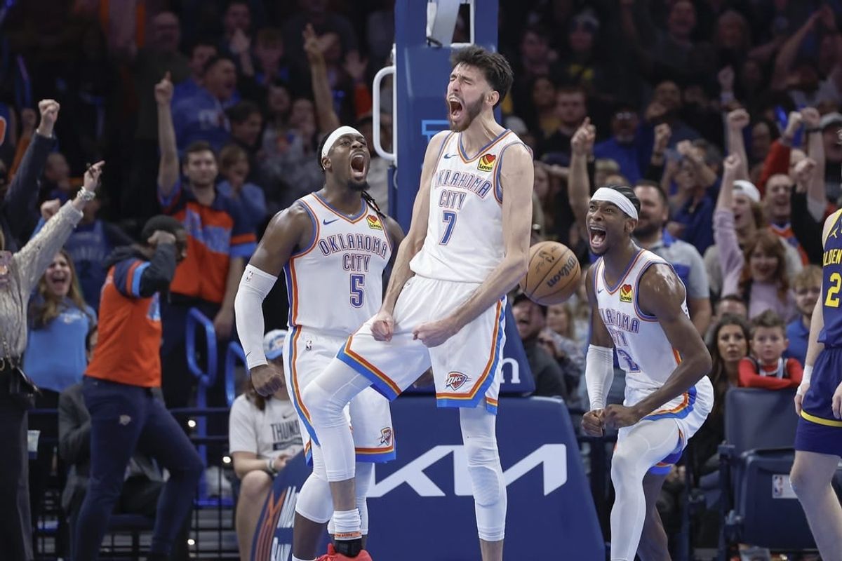Dec 8, 2023; Oklahoma City, Oklahoma, USA; Oklahoma City Thunder forward Chet Holmgren (7), guard Luguentz Dort (5) and guard Shai Gilgeous-Alexander (2) celebrate after Chet Holmgren scores a basket against the Golden State Warriors during the second half at Paycom Center.