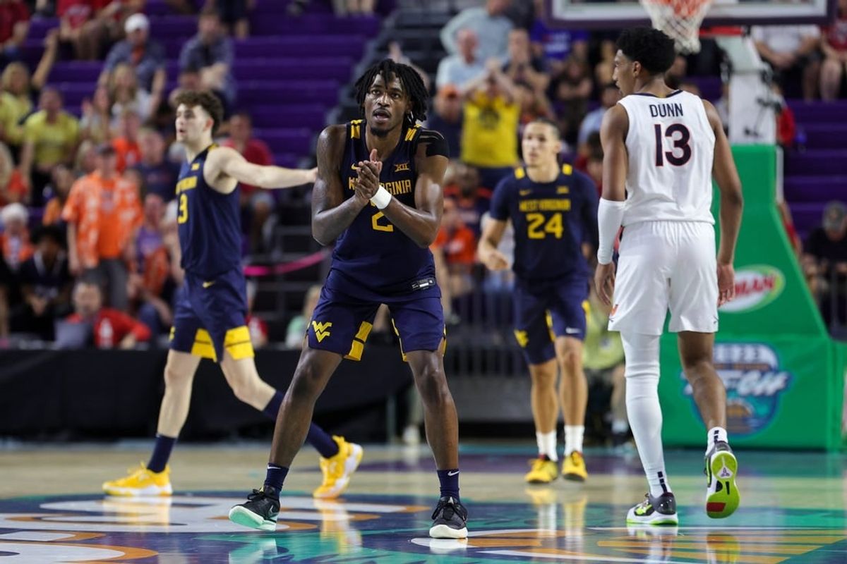 Nov 22, 2023; Fort Myers, FL, USA;  West Virginia Mountaineers guard Kobe Johnson (2) reacts after a play against the Virginia Cavaliers in the second half during the Fort Myers Tip-Off third place game at Suncoast Credit Union Arena.
