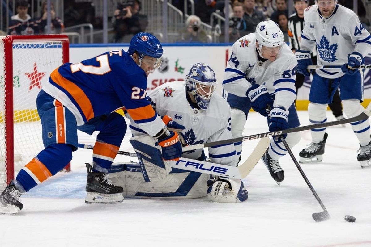 Dec 11, 2023; Elmont, New York, USA; Toronto Maple Leafs goaltender Ilya Samsonov (35) tracked the puck while New York Islanders left wing Anders Lee (27) attempts to score during the second period at UBS Arena.