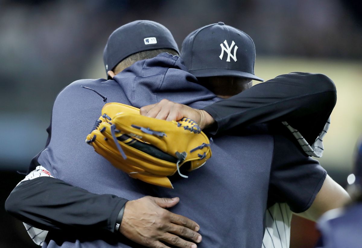 Sabathia embraces Dellin Betances after being removed from his last  regular-season home  start.