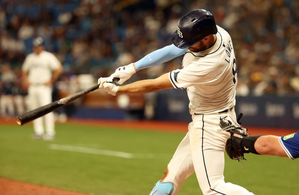 Mar 28, 2024; St. Petersburg, Florida, USA; Tampa Bay Rays first baseman Yandy Diaz (2) singles during the eighth inning against the Toronto Blue Jays at Tropicana Field.