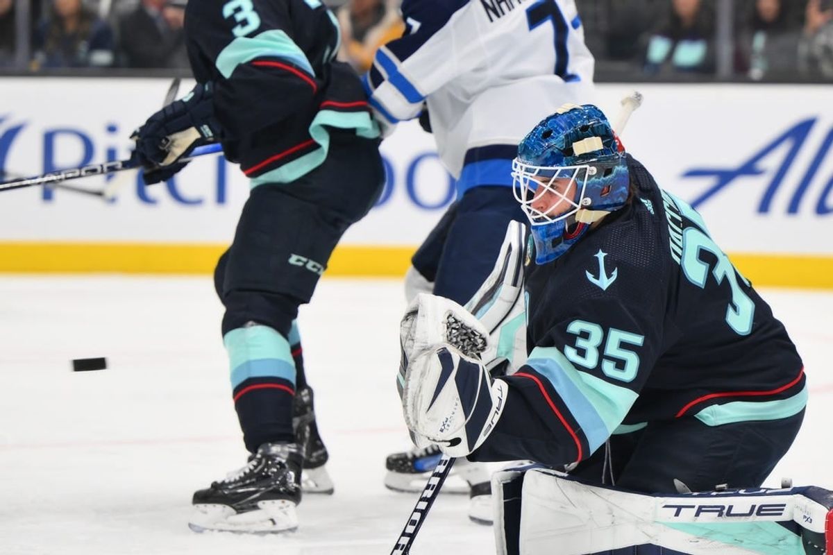Mar 8, 2024; Seattle, Washington, USA; Seattle Kraken goaltender Joey Daccord (35) blocks a goal shot against the Winnipeg Jets during the first period at Climate Pledge Arena.