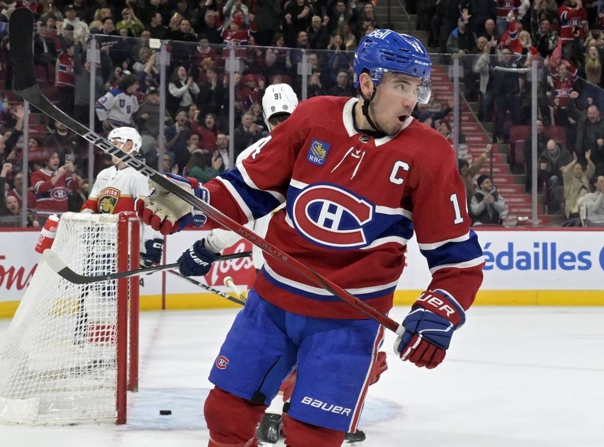 Apr 2, 2024; Montreal, Quebec, CAN; Montreal Canadiens forward Nick Suzuki (14) celebrates after scoring a goal against the Florida Panthers during the second period at the Bell Centre.