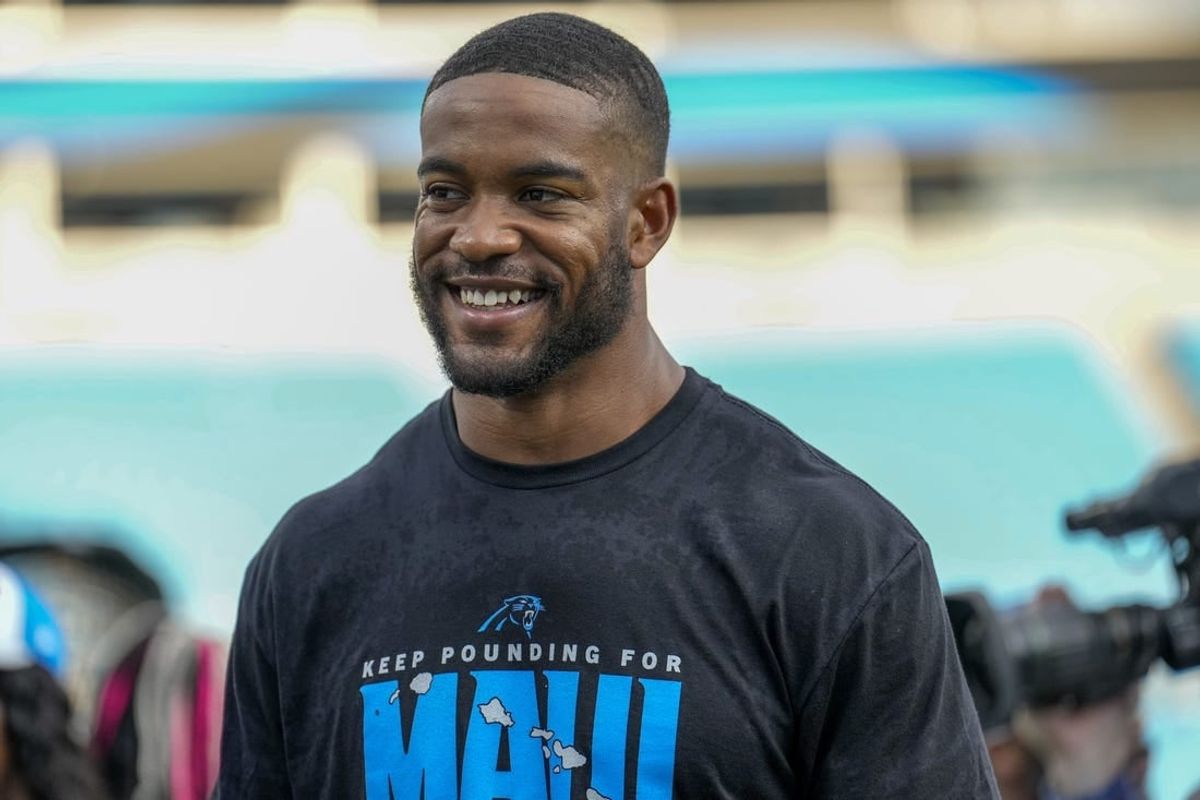 Aug 25, 2023; Charlotte, North Carolina, USA; Carolina Panthers safety Jeremy Chinn (21) talks with fans during pregame warm ups against the Detroit Lions at Bank of America Stadium.