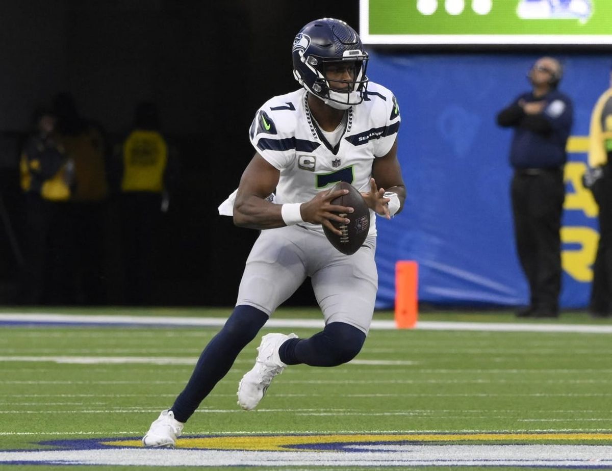 Nov 19, 2023; Inglewood, California, USA; Seattle Seahawks quarterback Geno Smith (7) controls the ball in the third quarter against the Los Angeles Rams at SoFi Stadium.