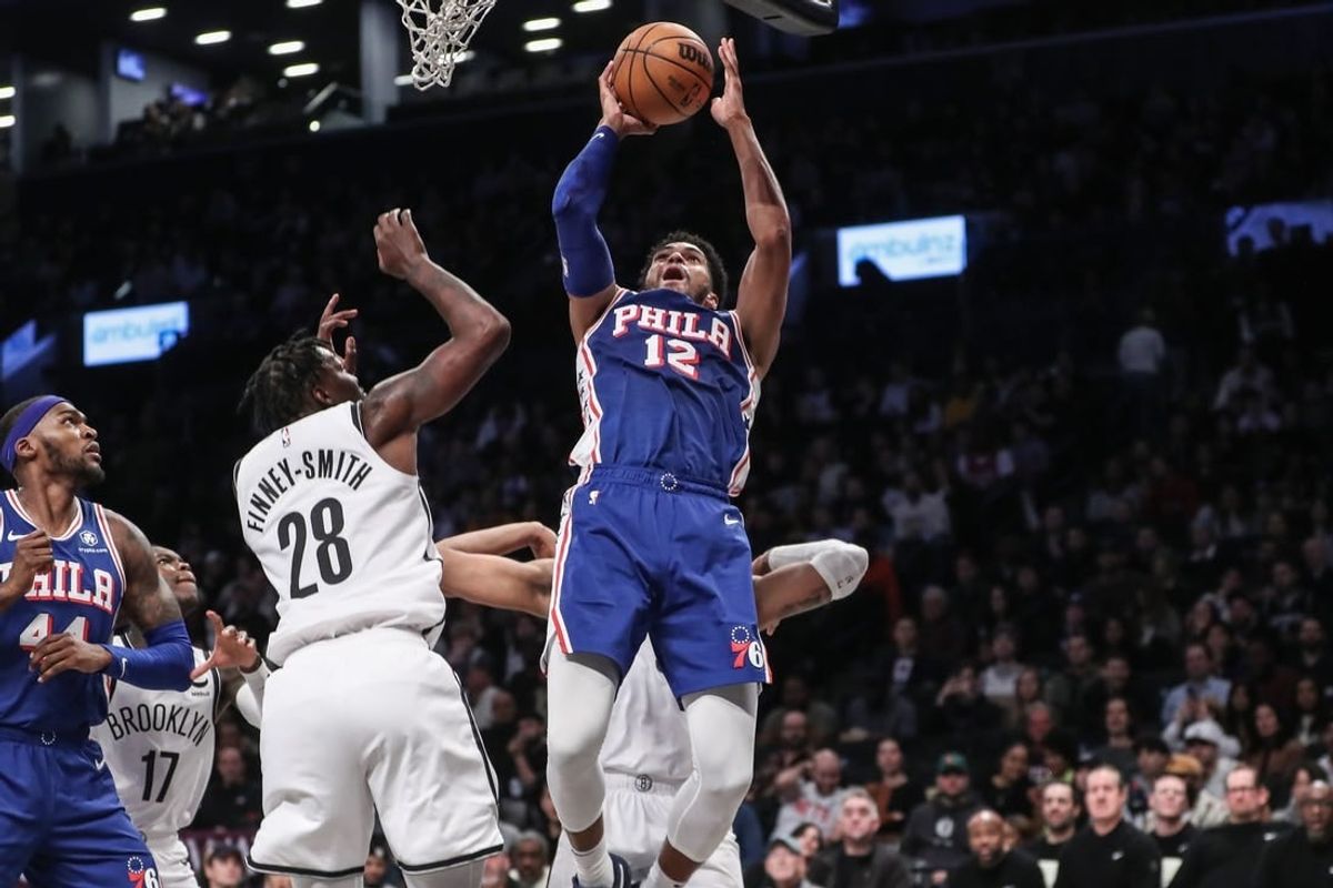 Mar 5, 2024; Brooklyn, New York, USA; Philadelphia 76ers forward Tobias Harris (12) drives past Brooklyn Nets forward Dorian Finney-Smith (28) for a jump shot in the second quarter at Barclays Center.