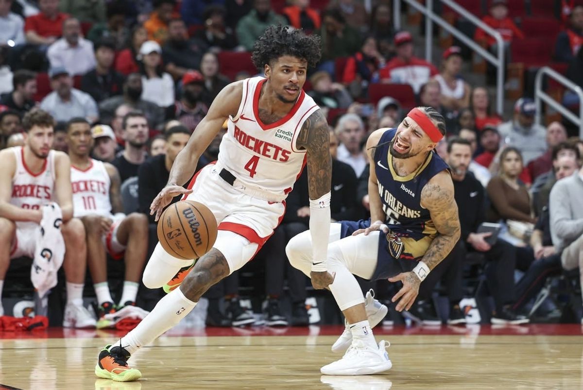 Jan 31, 2024; Houston, Texas, USA; New Orleans Pelicans guard Jose Alvarado (15) reacts as Houston Rockets guard Jalen Green (4) drives with the ball during the fourth quarter at Toyota Center.