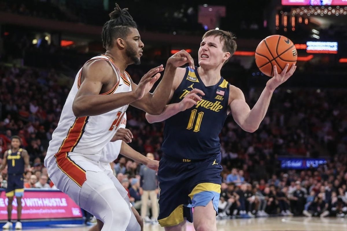 Jan 20, 2024; New York, New York, USA;  Marquette Golden Eagles guard Tyler Kolek (11) looks to drive past St. John's Red Storm forward Zuby Ejiofor (24) in the first half at Madison Square Garden.