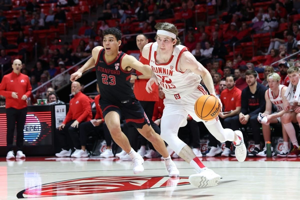 Feb 29, 2024; Salt Lake City, Utah, USA; Utah Utes center Branden Carlson (35) drives to the basket against Stanford Cardinal forward Brandon Angel (23) during the second half at Jon M. Huntsman Center.