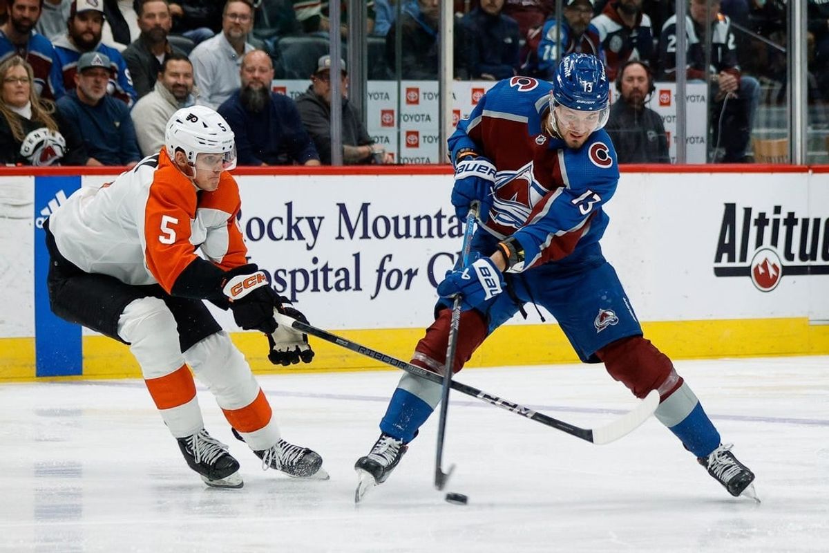 Dec 9, 2023; Denver, Colorado, USA; Colorado Avalanche right wing Valeri Nichushkin (13) shoots the puck as Philadelphia Flyers defenseman Egor Zamula (5) defends in the second period at Ball Arena.