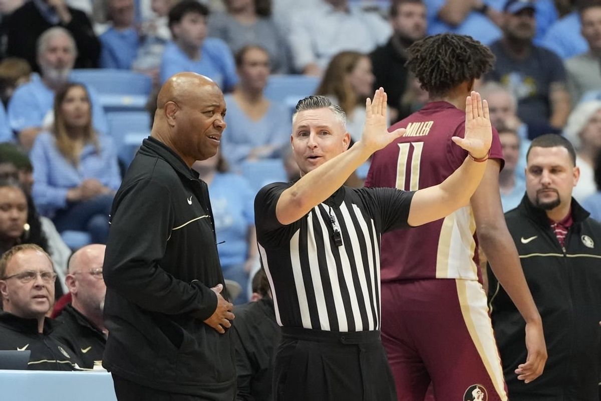 Dec 2, 2023; Chapel Hill, North Carolina, USA;  Florida State Seminoles head coach Leonard Hamilton with the official in the first half at Dean E. Smith Center.