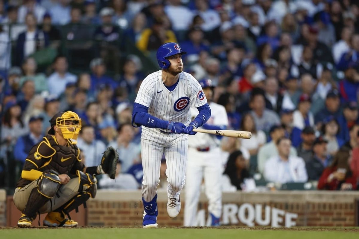 May 7, 2024; Chicago, Illinois, USA; Chicago Cubs outfielder Cody Bellinger (24) watches his solo home run against the San Diego Padres during the fourth inning at Wrigley Field.
