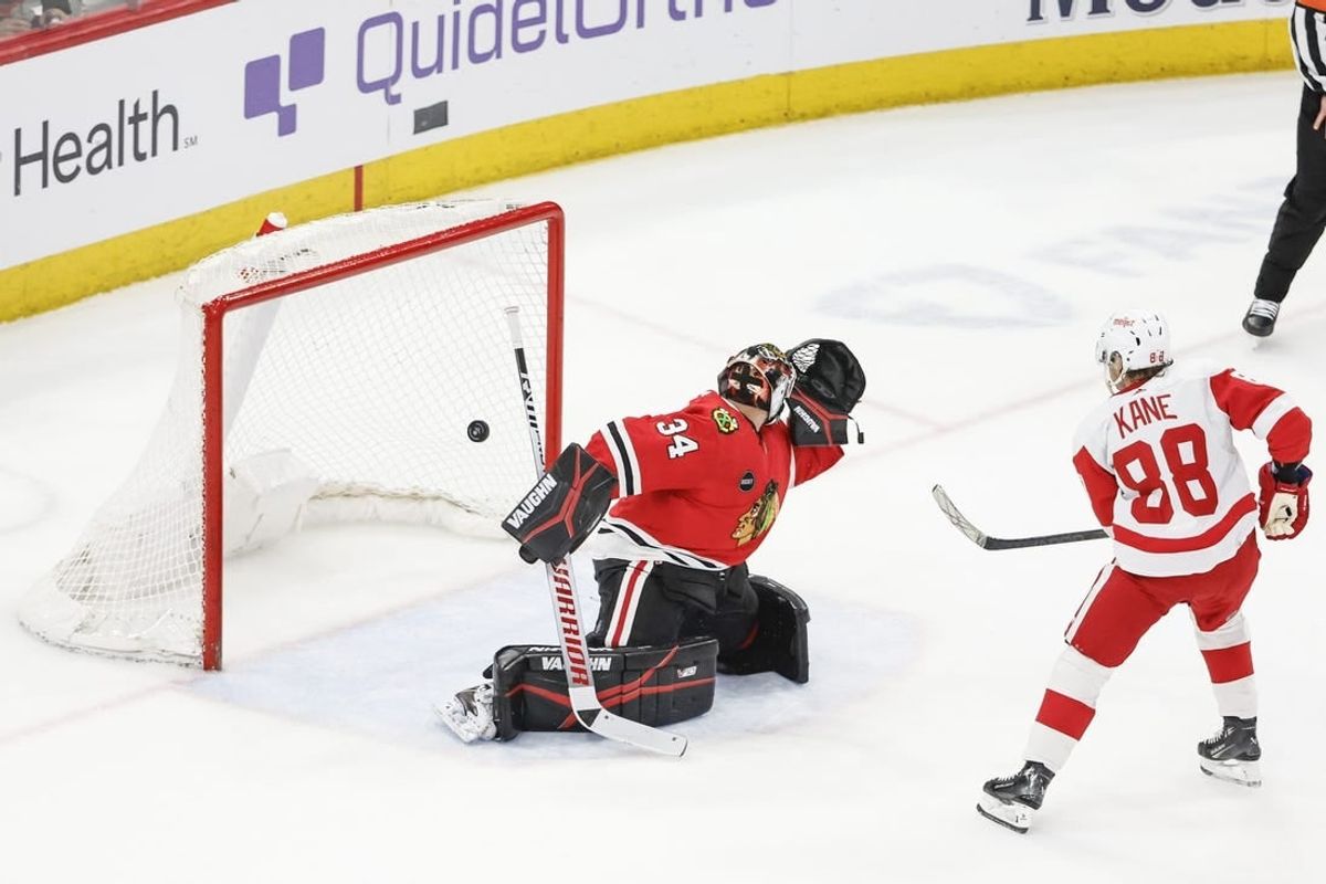 Feb 25, 2024; Chicago, Illinois, USA; Detroit Red Wings right wing Patrick Kane (88) scores game winning goal against Chicago Blackhawks goaltender Petr Mrazek (34) in overtime at United Center.