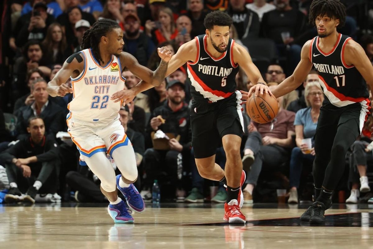 Nov 19, 2023; Portland, Oregon, USA;  Portland Trail Blazers guard Skylar Mays (5) dribbles up the court past Oklahoma City Thunder guard Cason Wallace (22) in the first half at Moda Center.