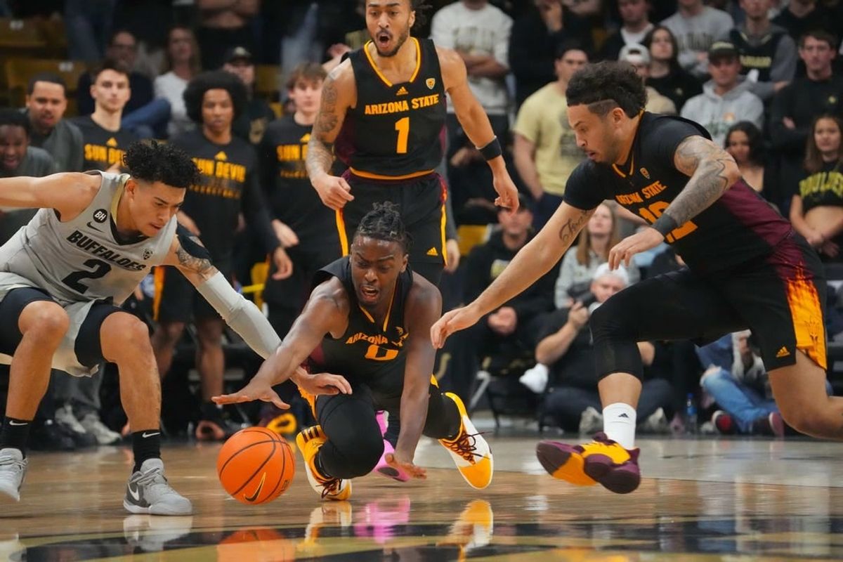 Feb 8, 2024; Boulder, Colorado, USA; Arizona State Sun Devils guard Kamari Lands (0) and guard Jose Perez (12) and Colorado Buffaloes guard KJ Simpson (2) reach for a loose ball in the first half at the CU Events Center.