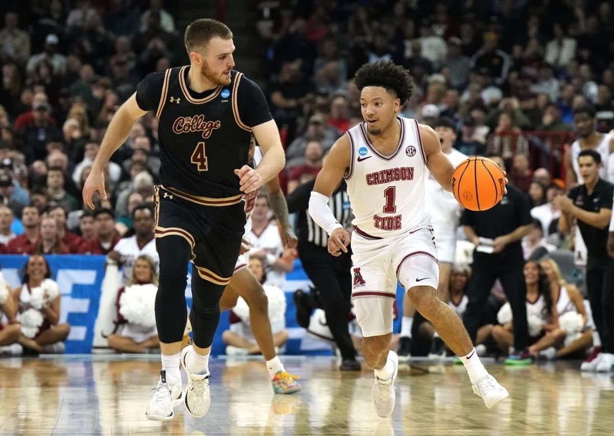 Mar 22, 2024; Spokane, WA, USA; Alabama Crimson Tide guard Mark Sears (1) dribbles against Charleston Cougars guard Bryce Butler (4) during the first half in the first round of the 2024 NCAA Tournament at Spokane Veterans Memorial Arena.