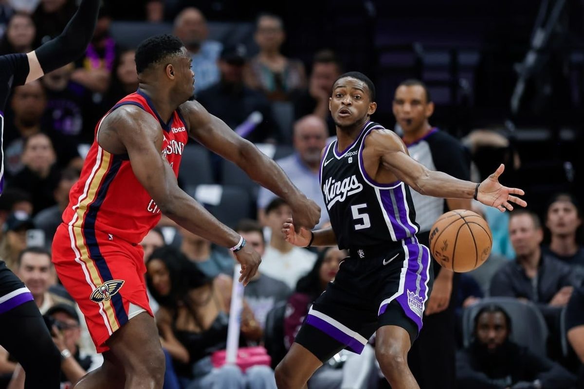 Apr 2, 2024; Sacramento, California, USA; Sacramento Kings guard De'Aaron Fox (5) breaks up a pass by New Orleans Pelicans forward Zion Williamson (1) during the second quarter at Golden 1 Center.