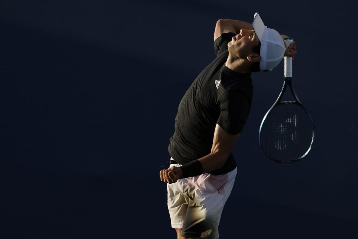 Mar 23, 2022; Miami Gardens, FL, USA; Jaume Munar (ESP) serves against Taro Daniel (JPN) (not pictured) in a first round men's singles match in the Miami Open at Hard Rock Stadium.
