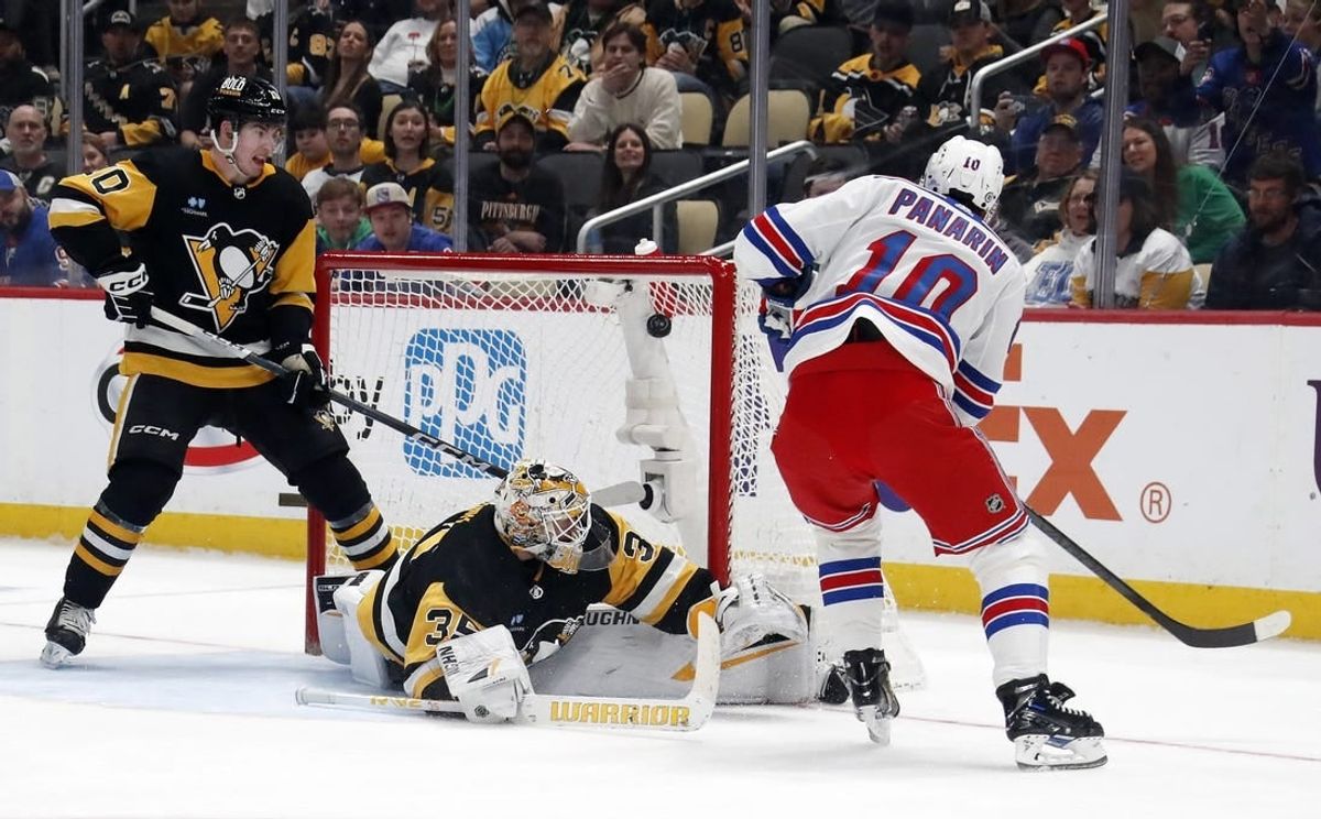 Mar 16, 2024; Pittsburgh, Pennsylvania, USA;  New York Rangers left wing Artemi Panarin (10) scores his second goal of the game against Pittsburgh Penguins goaltender Tristan Jarry (35) during the second period at PPG Paints Arena.