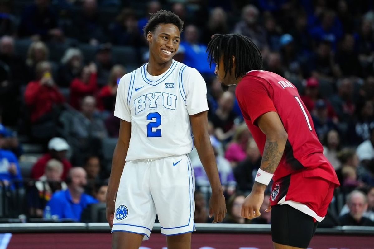 Nov 24, 2023; Las Vegas, NV, USA; Brigham Young Cougars guard Jaxson Robinson (2) and North Carolina State Wolfpack guard Jayden Taylor (1) await an inbounds play during the second half at Michelob ULTRA Arena.