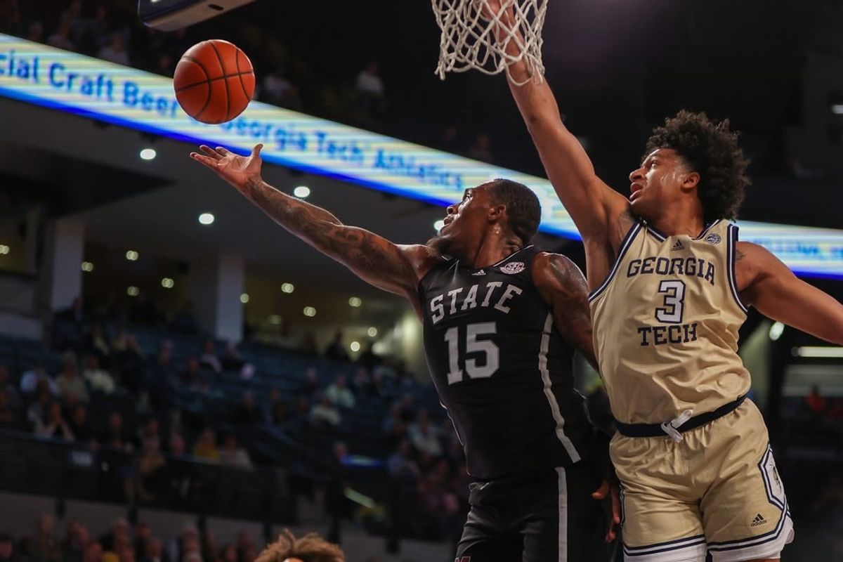 Nov 28, 2023; Atlanta, Georgia, USA; Mississippi State Bulldogs forward Jimmy Bell Jr. (15) grabs a rebound past Georgia Tech Yellow Jackets guard Dallan Coleman (3) in the first half at McCamish Pavilion.