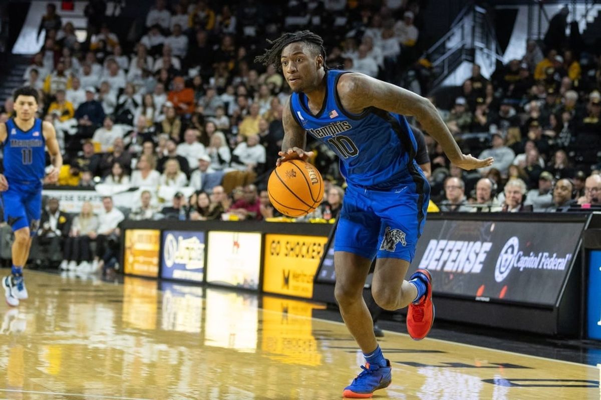 Jan 14, 2024; Wichita, Kansas, USA; Memphis Tigers guard Jaykwon Walton (10) brings the ball up court during the second half against the Wichita State Shockers at Charles Koch Arena.