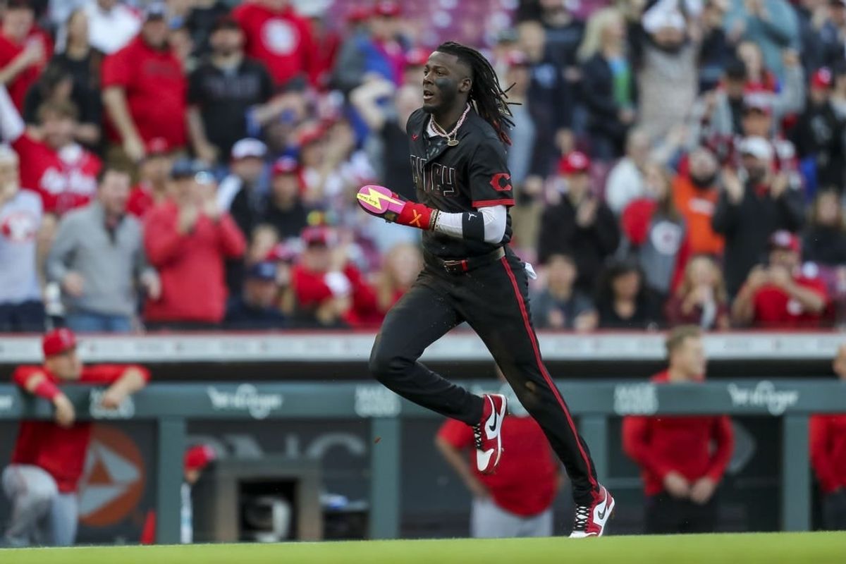 Apr 19, 2024; Cincinnati, Ohio, USA; Cincinnati Reds shortstop Elly De La Cruz (44) steals home on an error by Los Angeles Angels catcher Logan O'Hoppe (not pictured) in the second inning at Great American Ball Park.