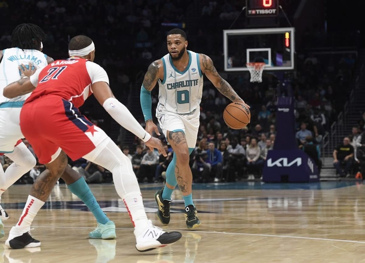 Nov 22, 2023; Charlotte, North Carolina, USA; Charlotte Hornets forward Miles Bridges (0) looks to drive during the first half against the Washington Wizards at the Spectrum Center.