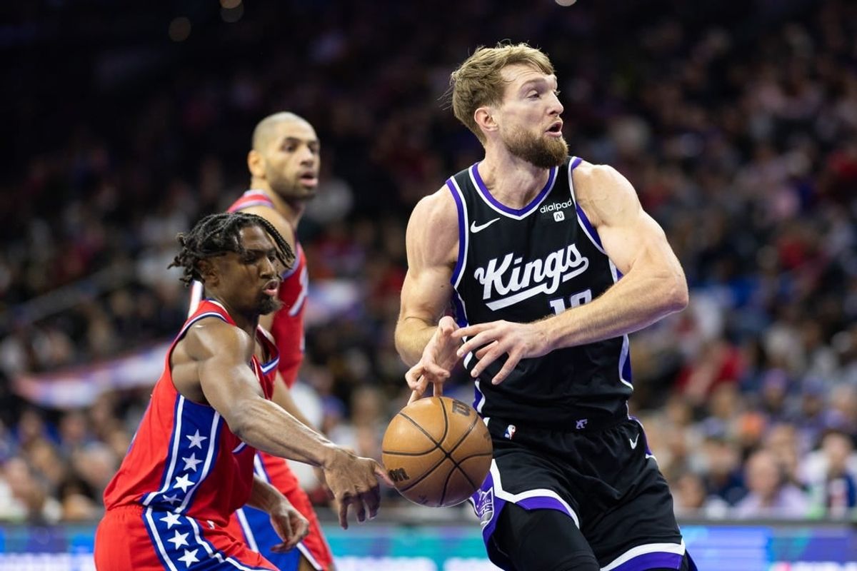 Jan 12, 2024; Philadelphia, Pennsylvania, USA; Philadelphia 76ers guard Tyrese Maxey (0) knocks the ball away from Sacramento Kings forward Domantas Sabonis (10) during the second quarter at Wells Fargo Center.