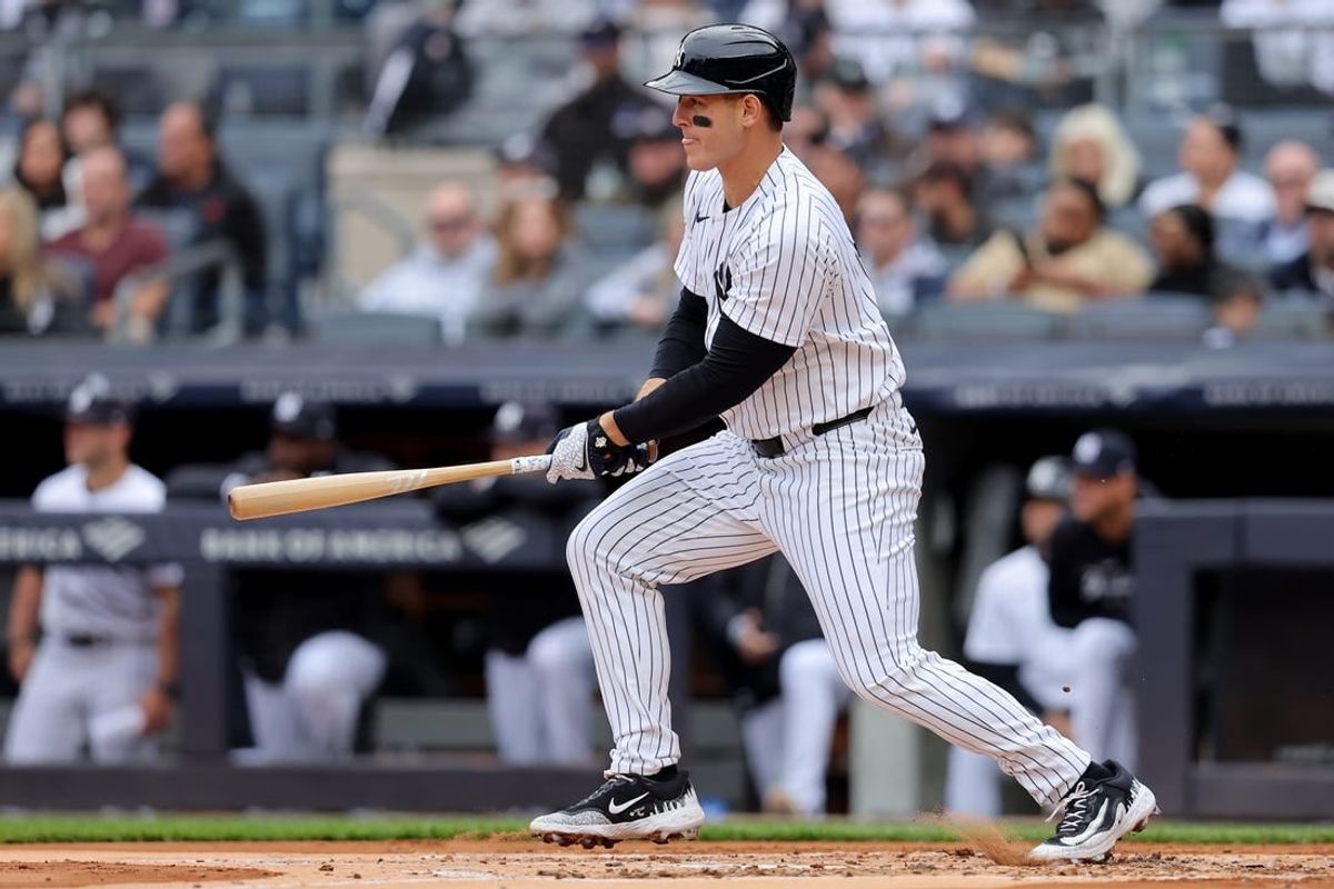 Apr 21, 2024; Bronx, New York, USA; New York Yankees first baseman Anthony Rizzo (48) follows through on an RBI single during the first inning against the Tampa Bay Rays at Yankee Stadium.