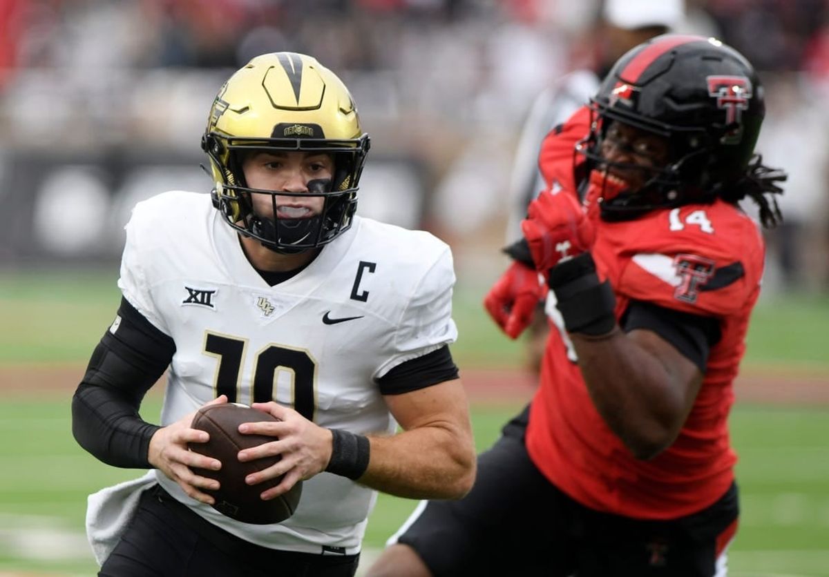 UCF's quarterback John Rhys Plumlee (10) runs with the ball against Texas Tech in a Big 12 football game, Saturday, Nov. 18, 2023, at Jones AT&T Stadium in Lubbock, Texas.