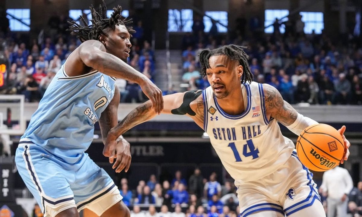Seton Hall Pirates guard Dre Davis (14) rushes up the court against Indiana State Sycamores guard Xavier Bledson (0) on Thursday, April 4, 2024, during the NIT championship game at Hinkle Fieldhouse in Indianapolis.