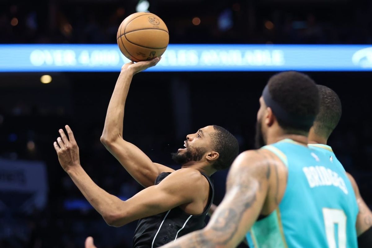 Mar 9, 2024; Charlotte, North Carolina, USA;  Brooklyn Nets forward Mikal Bridges (1) makes a shot against the Charlotte Hornets during the first quarter at Spectrum Center.