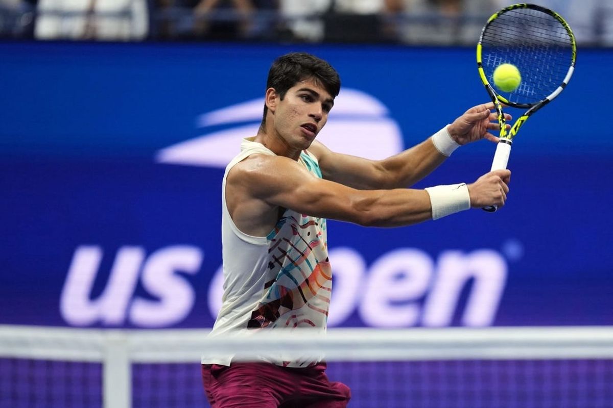 Sep 8, 2023; Flushing, NY, USA; Carlos Alcaraz of Spain hits to Daniil Medvedev in a men's singles semifinal on day twelve of the 2023 U.S. Open tennis tournament at USTA Billie Jean King Tennis Center.