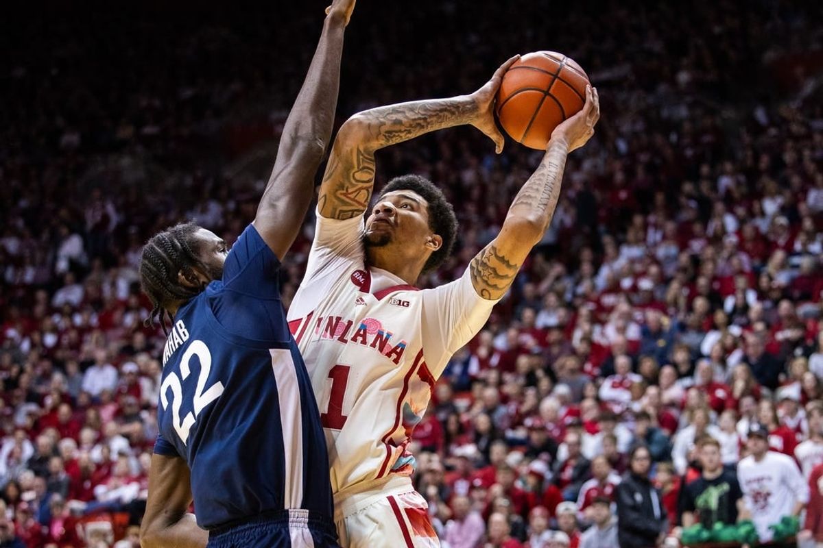 Feb 3, 2024; Bloomington, Indiana, USA; Indiana Hoosiers center Kel'el Ware (1) shoots the ball while Penn State Nittany Lions forward Qudus Wahab (22) defends in the first half at Simon Skjodt Assembly Hall.